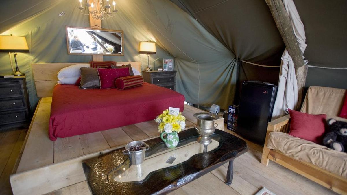 Last year’s glamping tent included heat and electric, a queen-size bed, furniture and more.