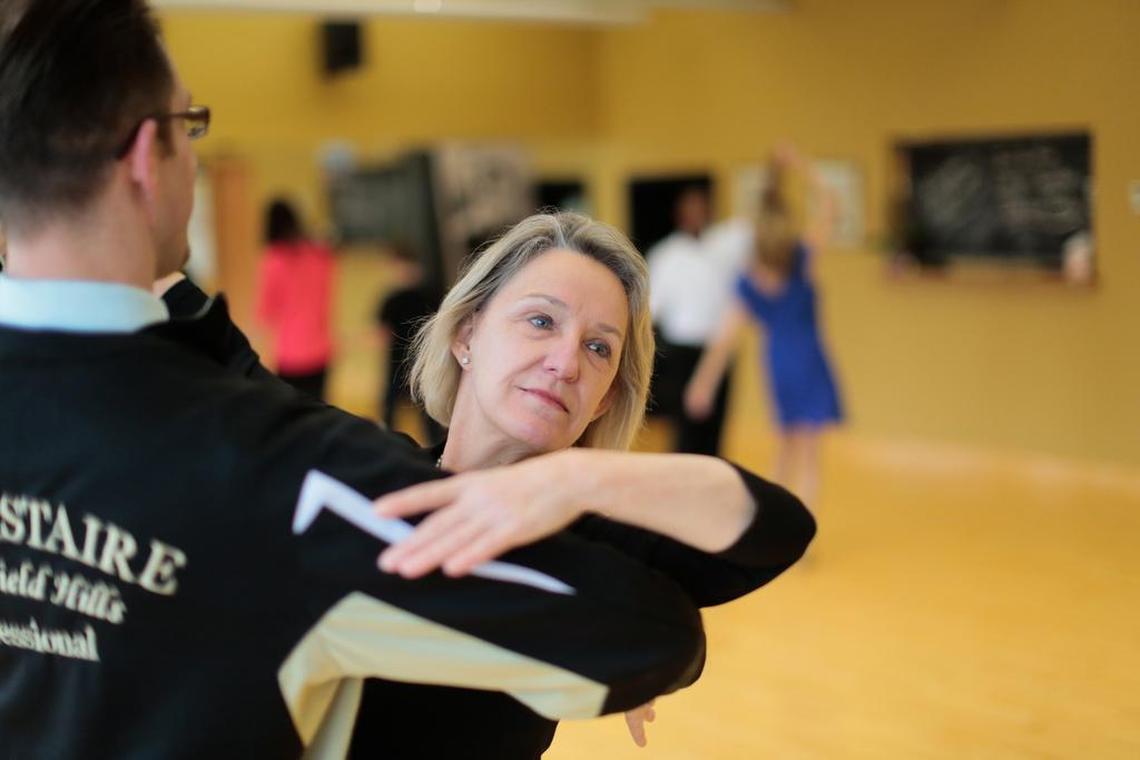 Michelle Allen demonstrates dancing with instructor Donald Westphal for a photo at the Fred Astaire Dance Studio on Tuesday, Dec. 29, 2015 in Bloomfield Hills, Mich.
