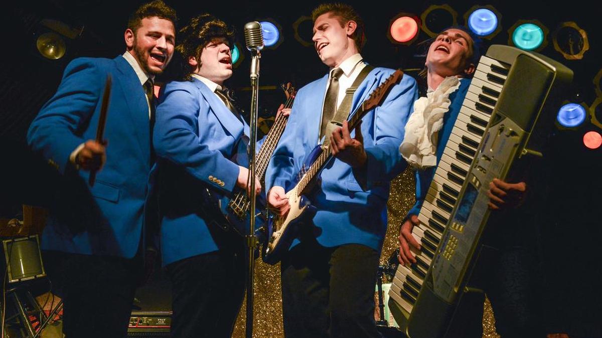 From left, Dario Reyes, Chris Hirsh, Mark Bolden and Austen Auriemma play members of “Simply Wed” in the State College Community Theatre production of “The Wedding Singer.”