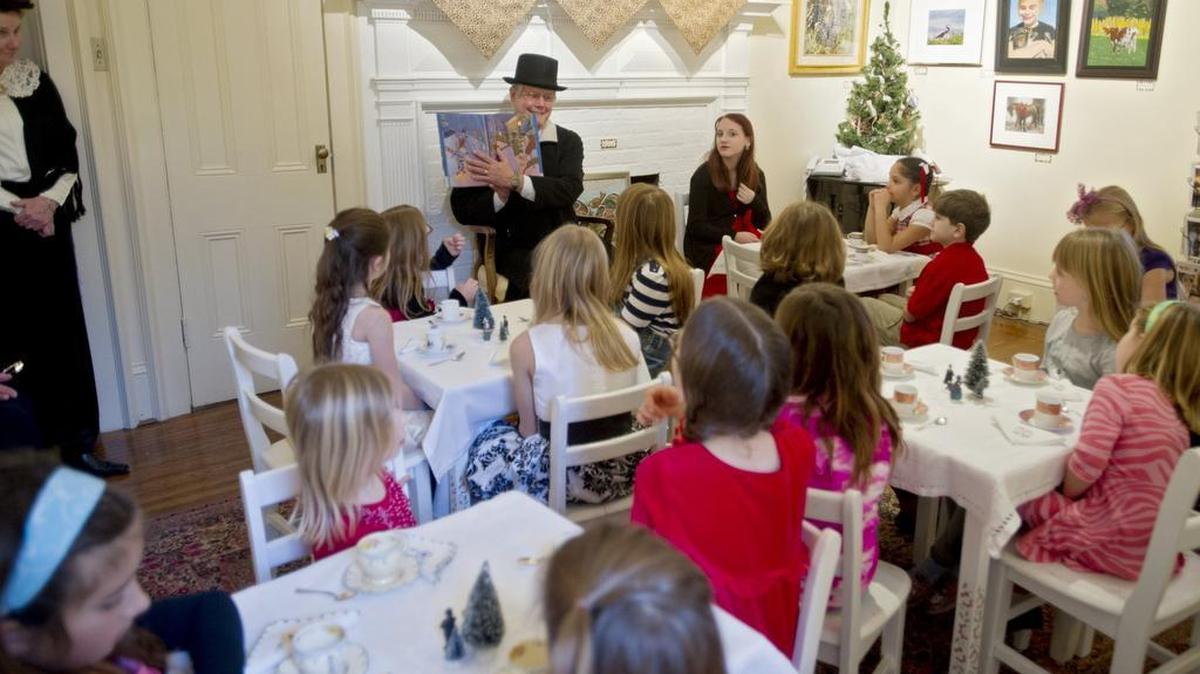 Dave Grine reads “Snowmen at Christmas” to youngsters during Victorian tea at the Bellefonte Arts Museum during Bellefonte Victorian Christmas in 2014.