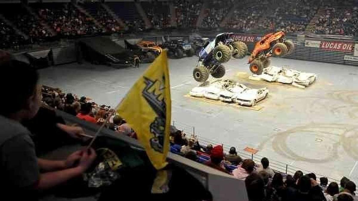 The Original Monster Truck, Bigfoot, smashes over cars in the wheelie competition during the 2011 Monster Truck Nationals at the Bryce Jordan Center.
