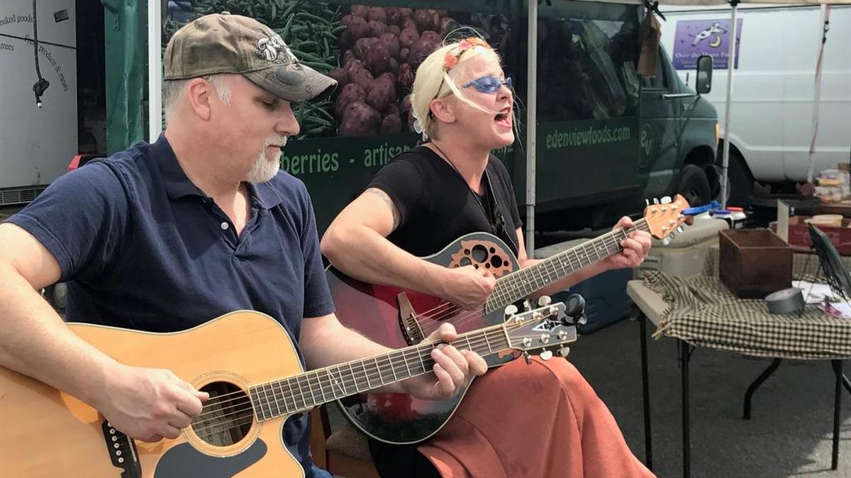 Mark Hill, left, and Kelly Countermine of Biscuit Jam perform at the Boalsburg Farmers Market on Tuesday.