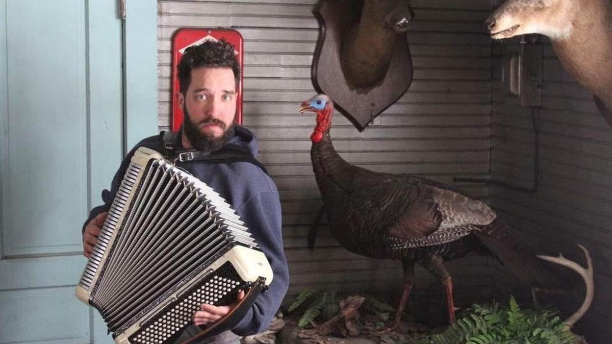 Local musician Danny Brumbaugh plays a bass, snare drum, guitar, harmonica/kazoo and sings all at the same time.