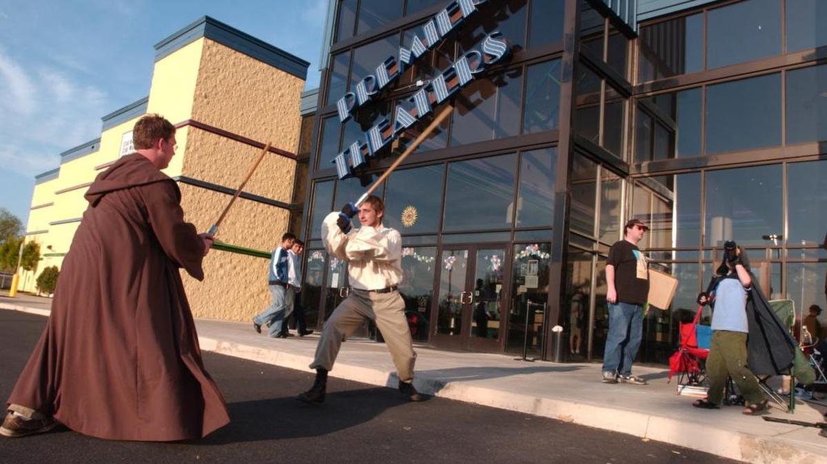 “Star Wars” fans have a mock battle in State College while awaiting the midnight showing of “Star Wars: Episode III — Revenge of the Sith” in May 2005.
