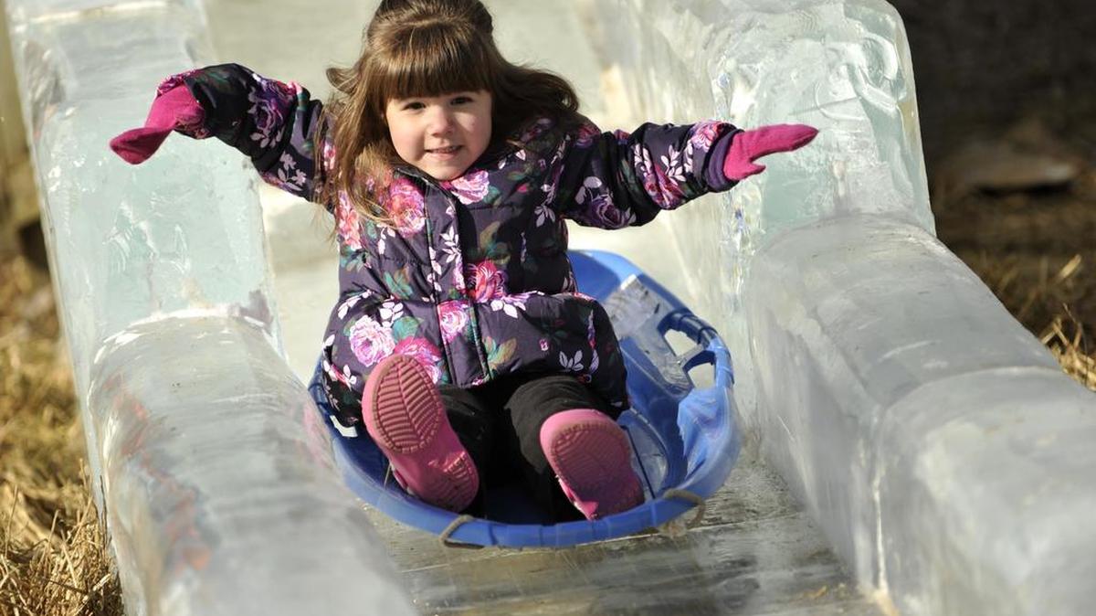 Caelyn Simpson, 3, of Bellefonte, sleds down the ice slide in Sidney Friedman Park in 2014.