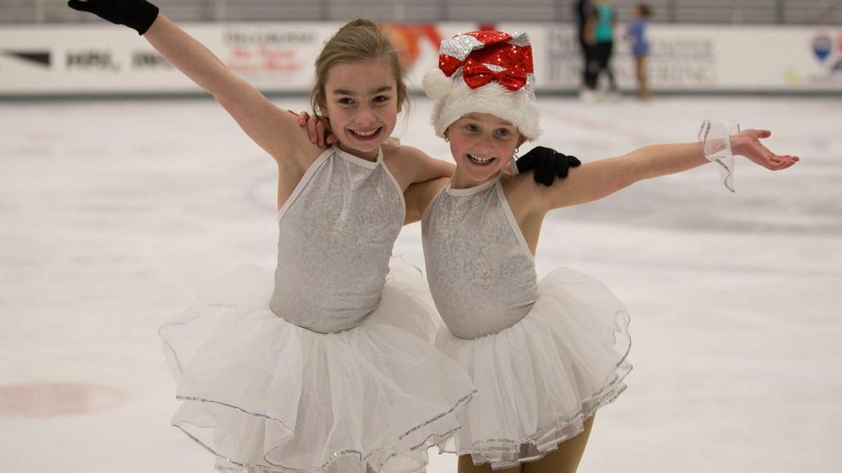 Amber Thompson, left, and Kendall Cramer pose during a rehearsal for this year’s Holiday Ice Show.