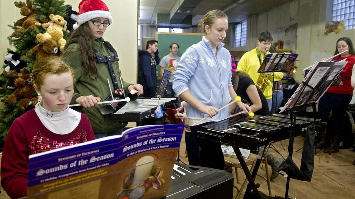 Members of the Philipsburg-Osceola symphonic band play holiday tunes during the music boosters cookie sale in 2014.