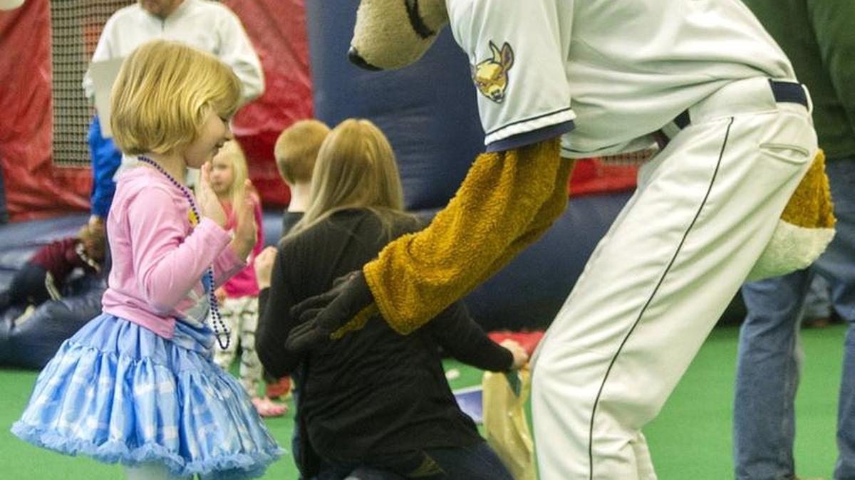 Trinity Smack dances with Ike the Spike during the 2016 SpikesFest at the Penn State Multi-Sports Indoor Facility.