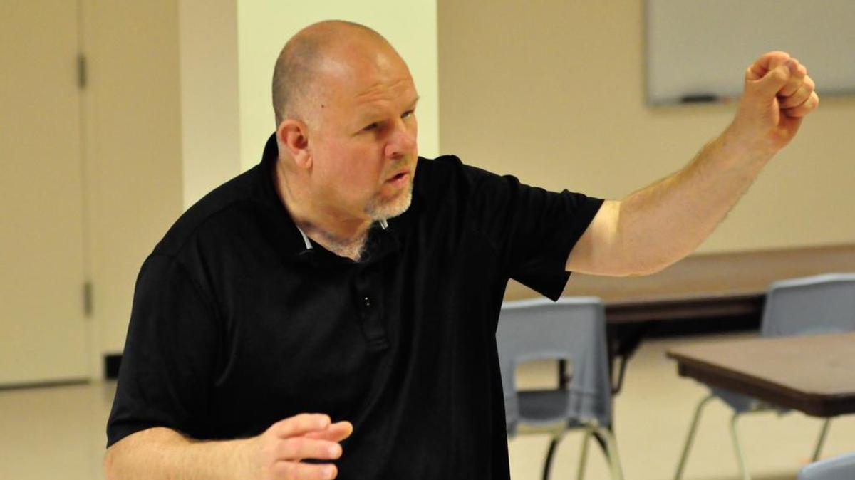 Graham Sanders teaches voice at Penn State and recently took over as director of the Nittany Knights Barbershop Chorus.