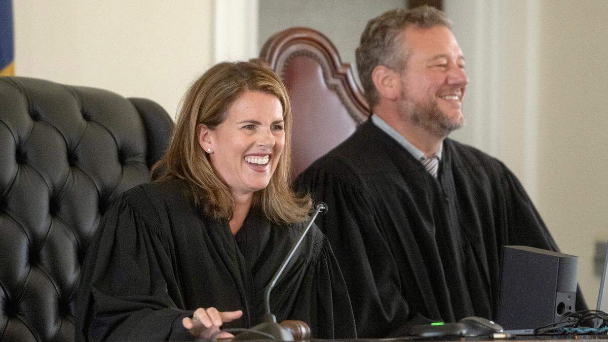 Judge Julia R. Rater laughs during her swearing-in ceremony on Aug. 21 at the Centre County Courthouse.