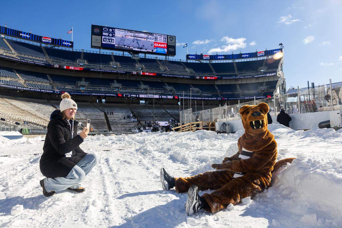 The Nittany Lion plays in the snow during the Penn State women’s hockey game at Beaver Stadium on Friday, Jan. 30, 2026, in State College.