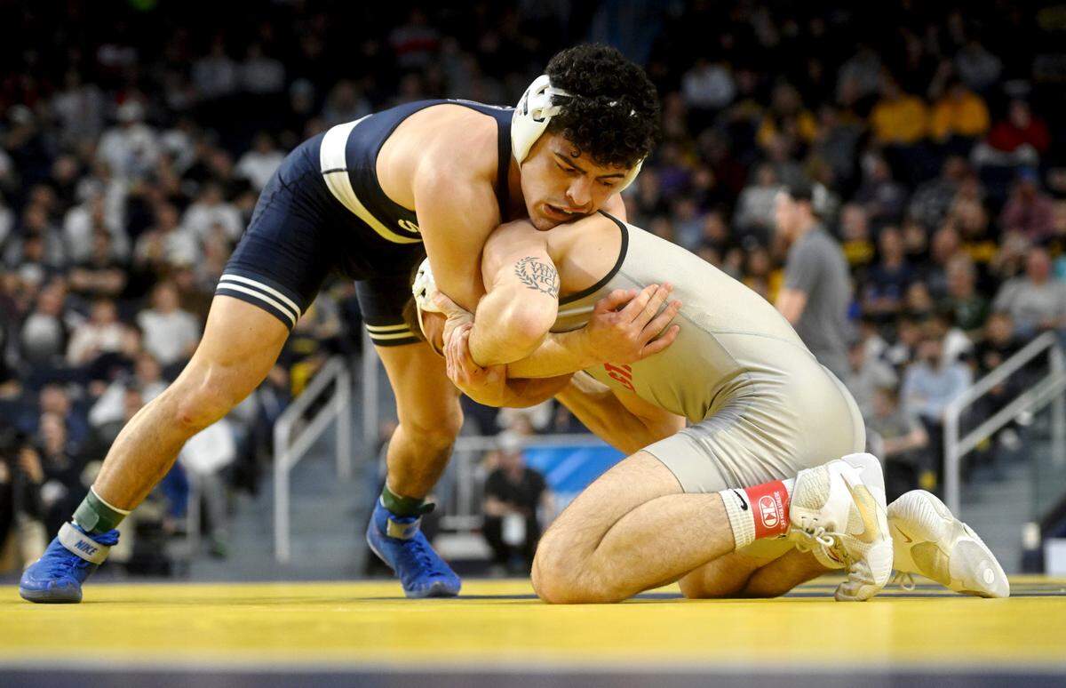 Penn State’s Beau Bartlett wrestles Ohio State’s Dylan D’Emilio in the 141 lb third place bout of the Big Ten wrestling championships at the Crisler Center on Sunday, March 5, 2023.