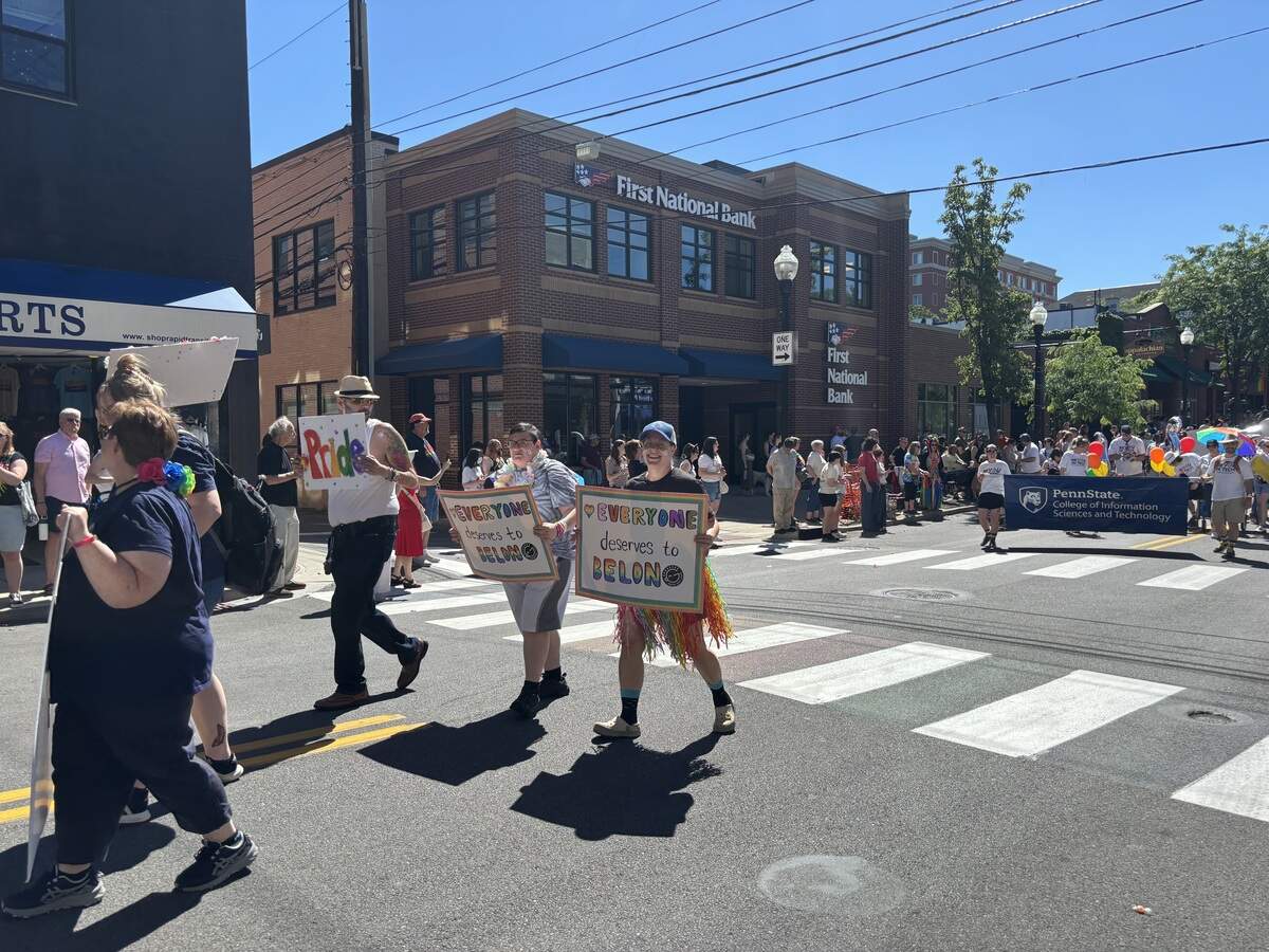 Marchers move along South Allen Street during the State College Pride parade on Saturday, June 13, 2026.