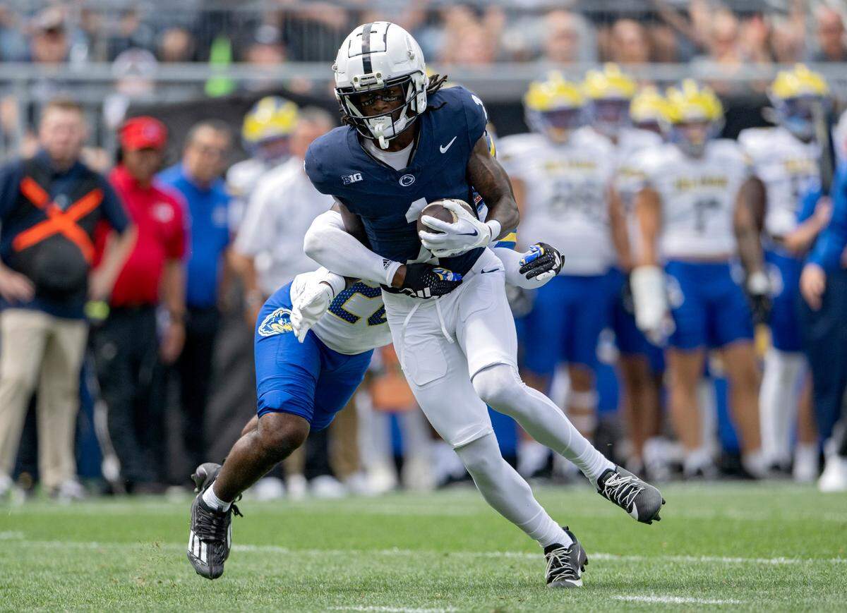 A Deleware defenders reaches for Penn State wide receiver KeAndre Lambert-Smith during the game on Saturday, Sept. 9, 2023.