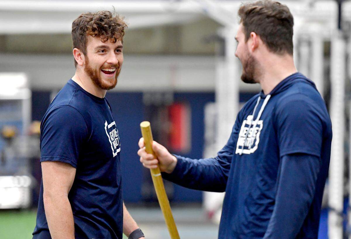 Penn State quarterback Sean Clifford laughs with teammates during a weight lifting session on Thursday, March 3, 2022.