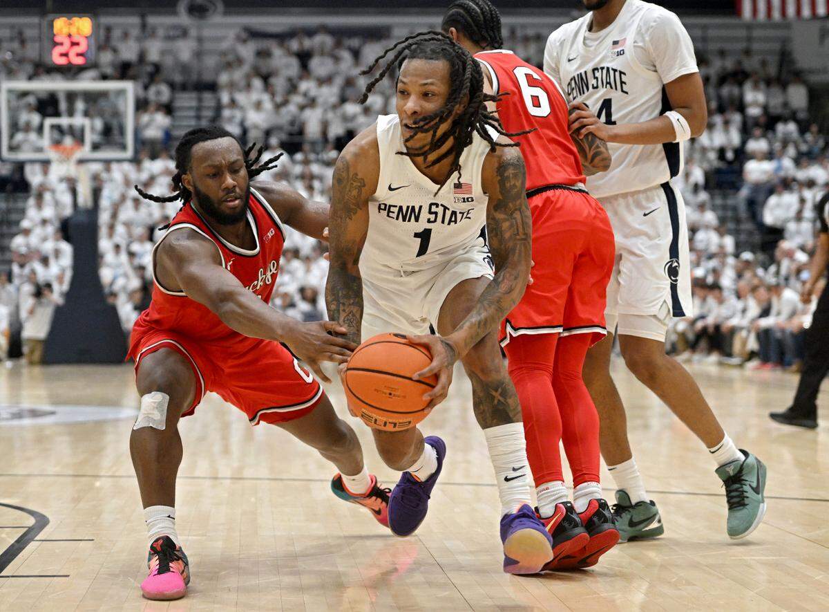 Penn State’s Ace Baldwin Jr. dribbles around Ohio State defenders during the game on Thursday, Jan. 30, 2025 at Rec Hall.