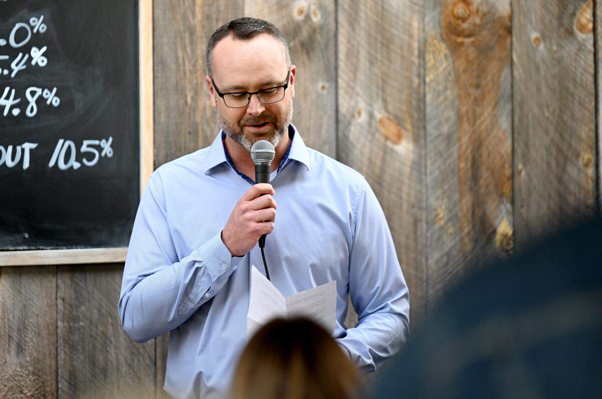 Happy Valley Adventure Bureau deputy director Eric Engelbarts talks about Matthew Hollingham’s Arctic to Africa triathlon on Tuesday, May 12, 2026 during a kick off event at Boal City Brewery. 