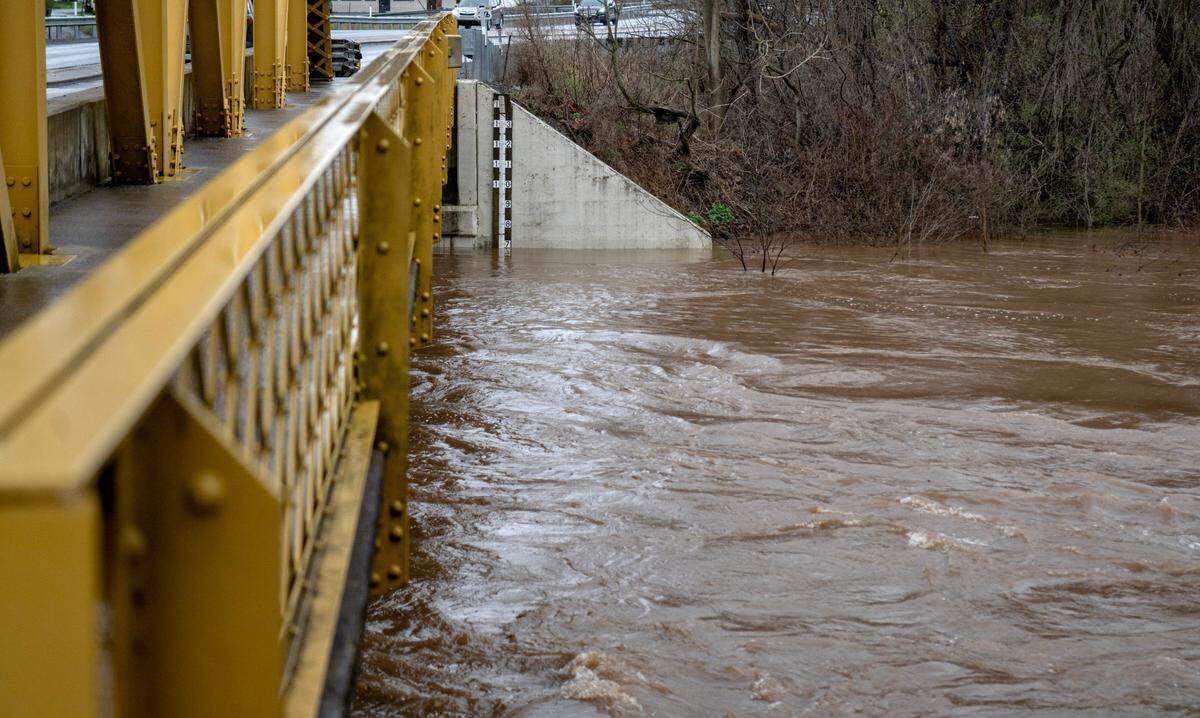 High water rushes under Veterans Bridge in Milesburg on Wednesday, April 3, 2024.