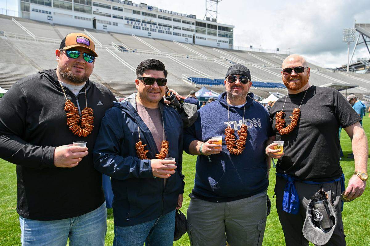 Friends pose together early on at the 2024 Hoppy Valley Brewers Fest at Penn State’s Beaver Stadium. 