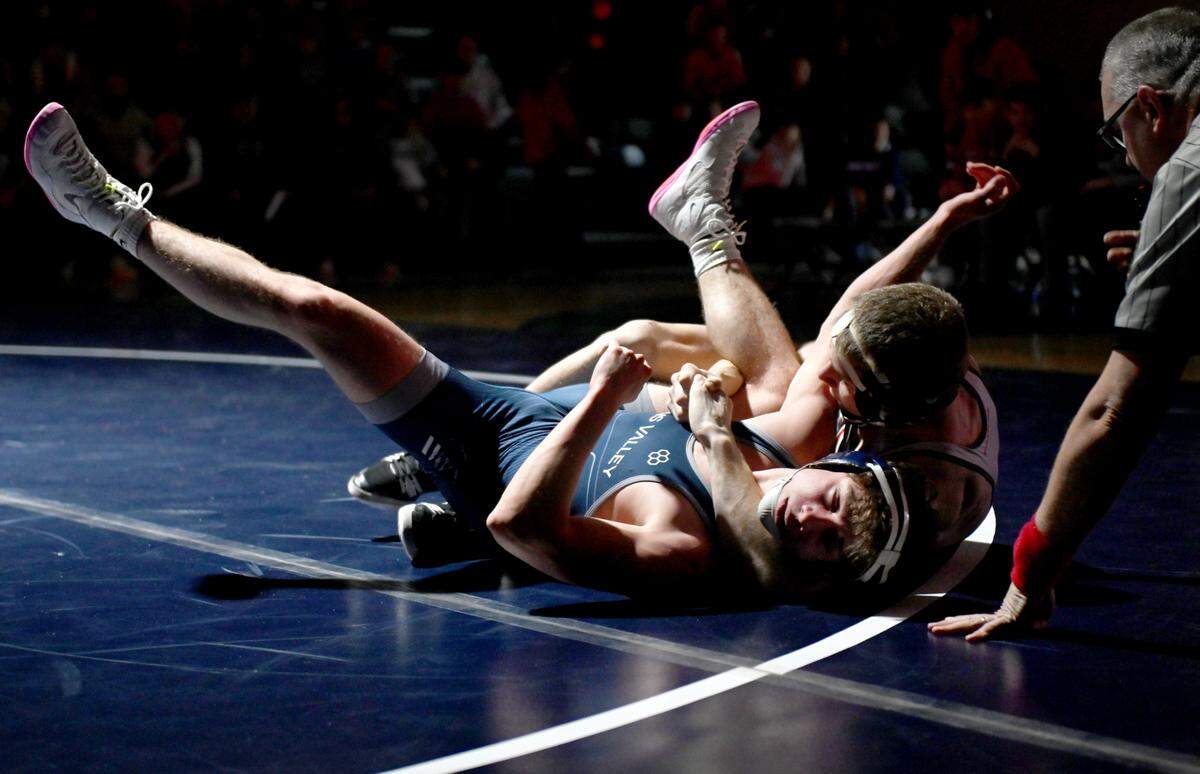 Bellefonte’s Wyatt Long controls Penns Valley’s Zach Rummel in the 139 lb bout of the wrestling match on Thursday, Jan. 16, 2025. Long won by major decision, 9-1.