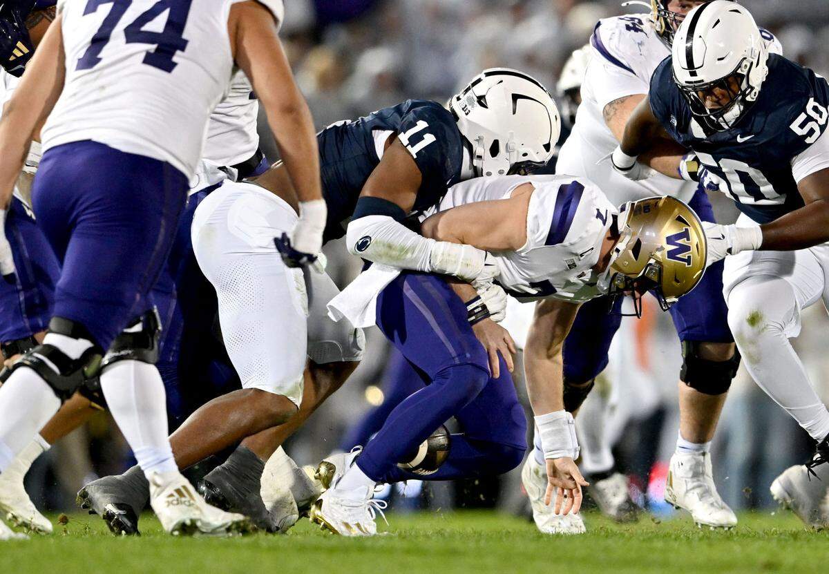 Penn State defensive end Abdul Carter sacks Washington quarterback Will Rogers during the game on Saturday, Nov. 9, 2024.