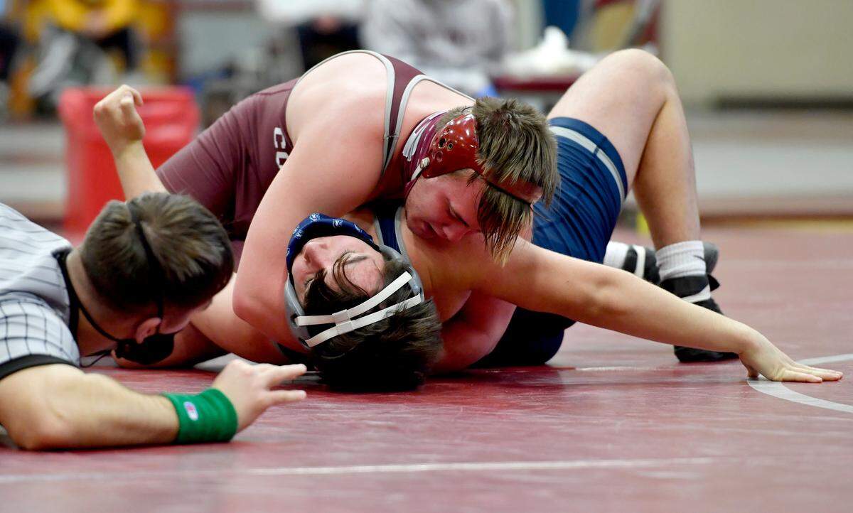 State College’s Carson Manville gets points as he controls Chambersburg’s Aiden Hight in the 189 lb bout during the match on Monday, Feb. 8, 2021. Manville won by major decision, 11-2.