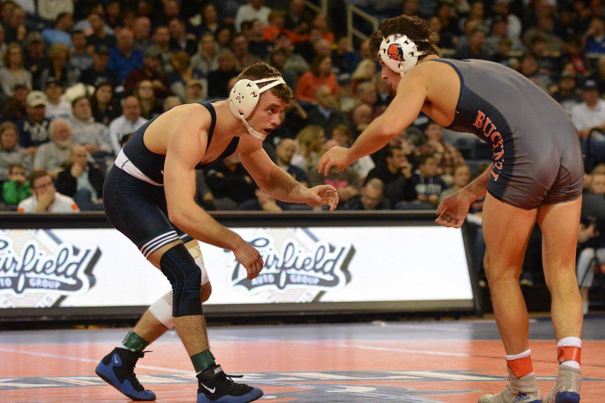 Penn State’s Brady Berge (left) made his debut in a dual for the Nittany Lions in a 42-3 win over Bucknell on Friday night. Berge did it emphatically with a 25-10 technical fall over the Bison’s Joey Schiele.