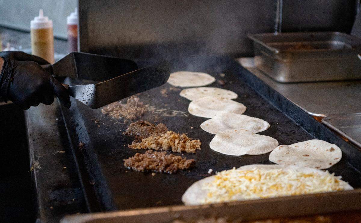 An order of tacos and a quesadilla on the grill at Carter’s Table on Wednesday, March 22, 2023.