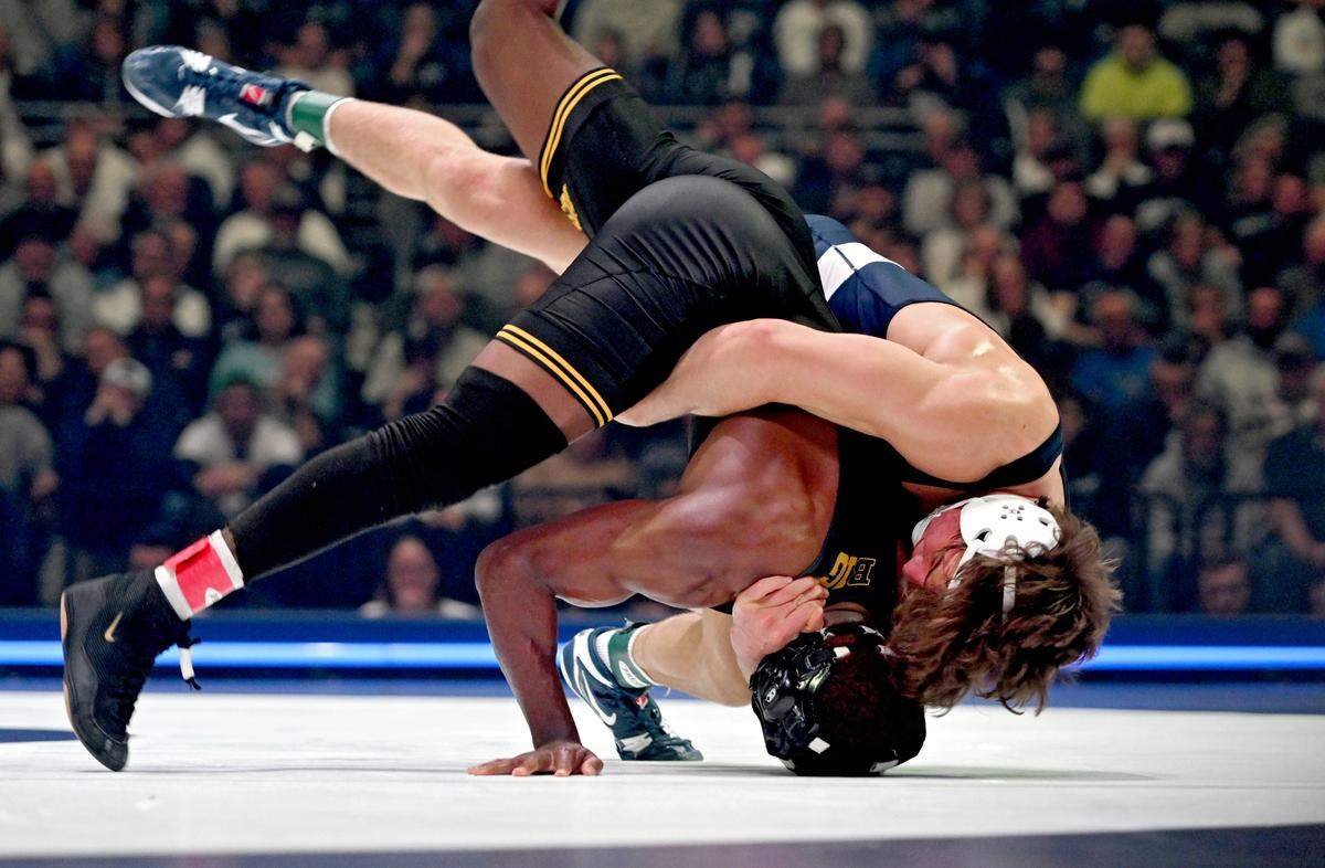 Penn State’s Tyler Kasak flips Iowa’s Jacori Teemer in the 157 lb bout of the match on Friday, Jan. 31, 2025 at the Bryce Jordan Center. Kasak won by decision, 5-2.