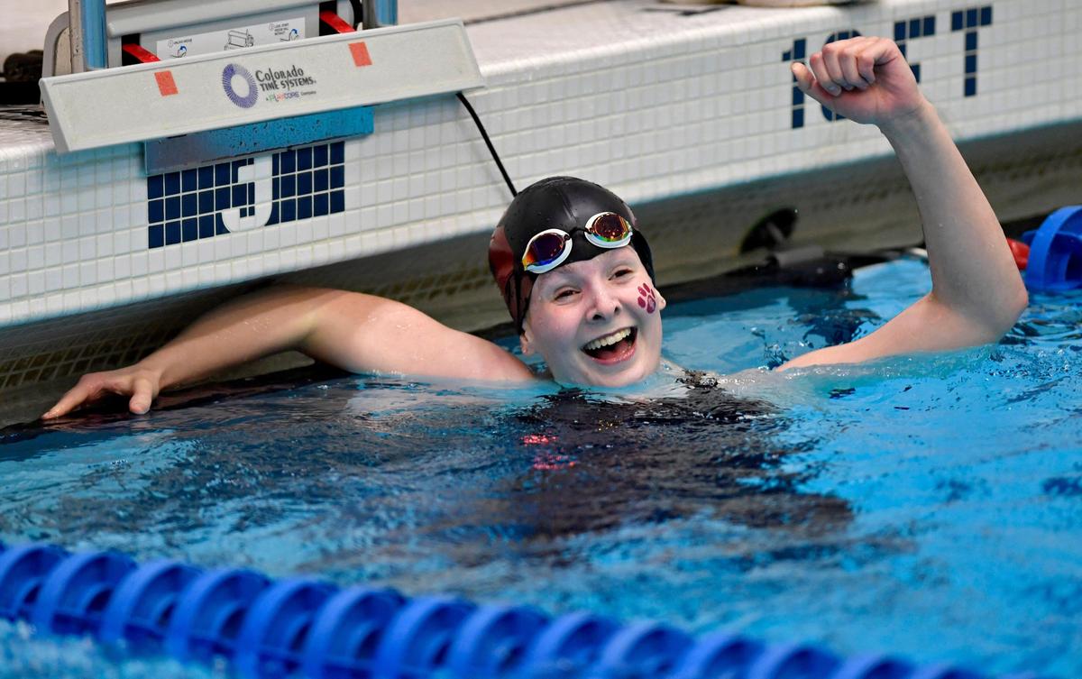 State College’s Colleen Adams celebrates winning the girls AAA 200 yard freestyle during the District 6 swimming championships on Friday, Feb. 28, 2020.