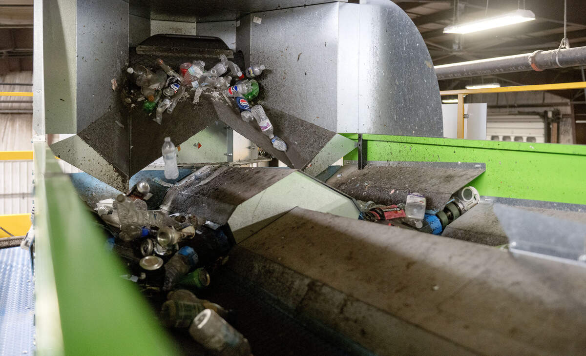 Recycled items are poured onto a conveyor belt to be sorted by the new Alchemy artificial intelligence system at the Centre County Recycling and Refuse Authority on Tuesday, July 7, 2026.