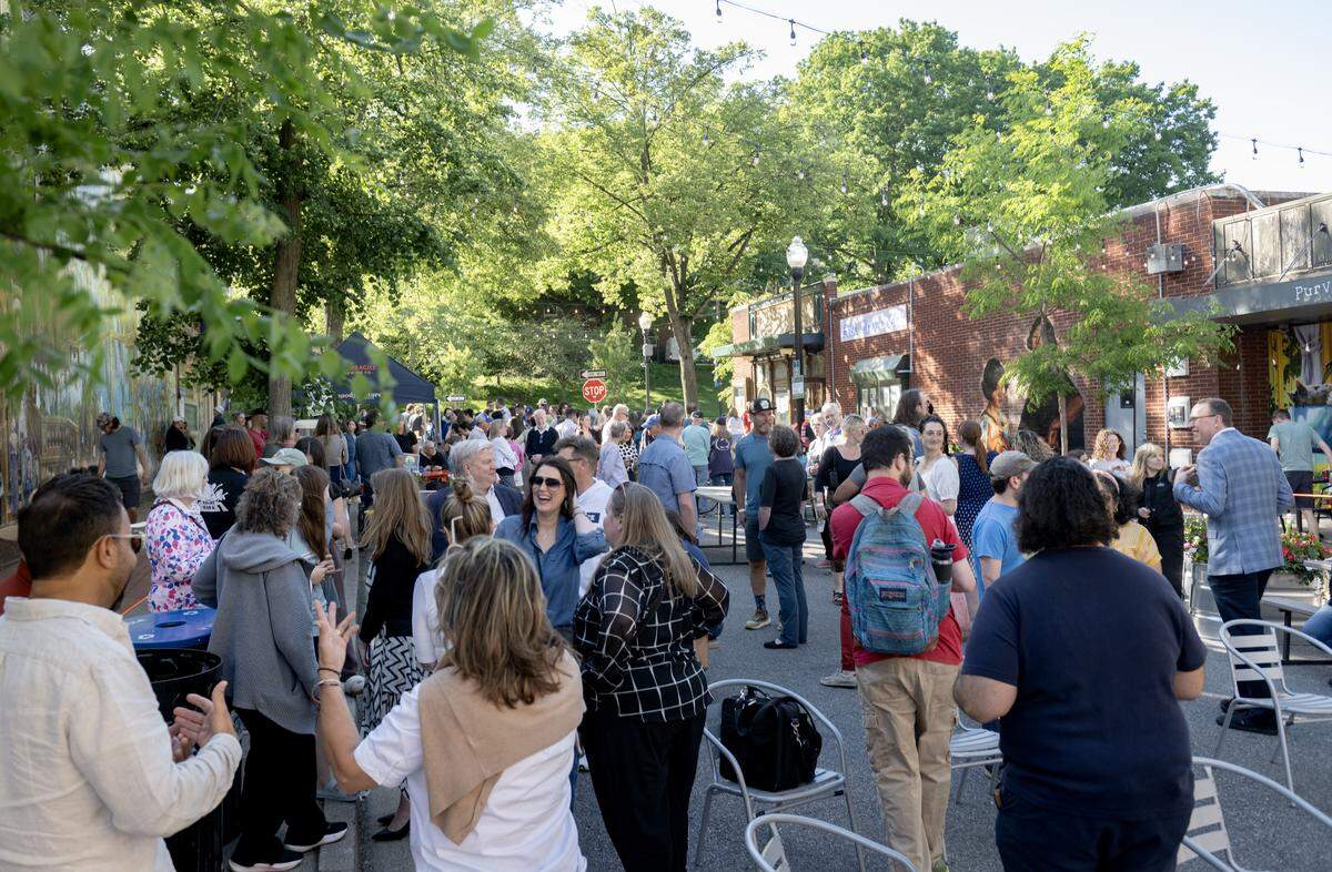 Community members take in the opening block party for East End Social on Thursday, May 28, 2026. 