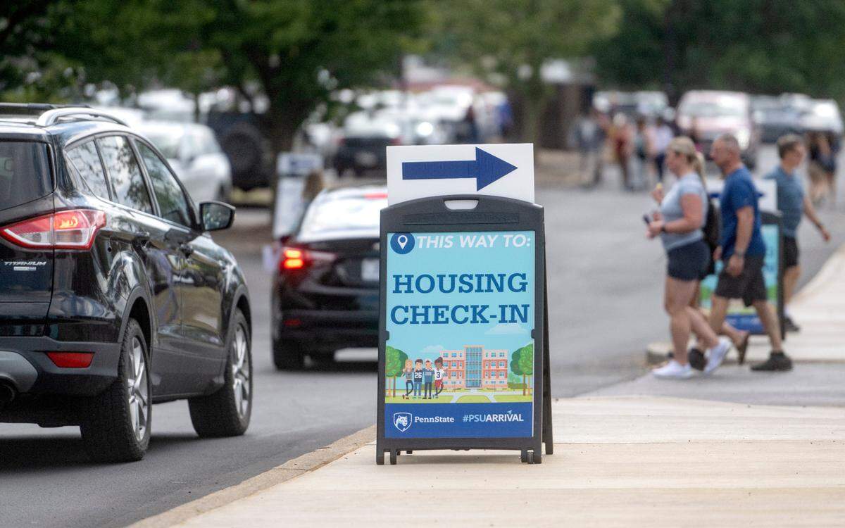 Traffic in the lots around the Bryce Jordan Center for Penn State housing check-in on Thursday, Aug. 17, 2023.