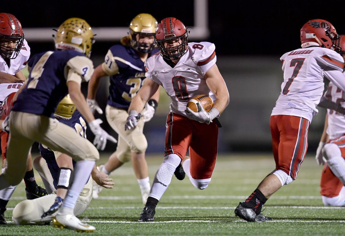 Bellefonte’s CJ Funk cuts down the field through Bald Eagle Area defenders during the game on Friday, Oct. 25, 2019.
