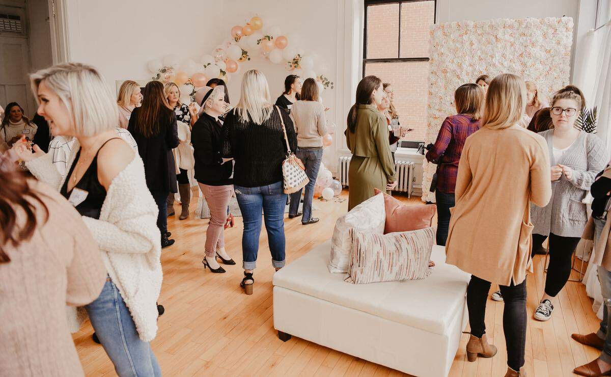 Local creatives and business owners mingle at the first local girl gang meet-up on Feb. 24, 2019 at Lydia Shafer Photography in Bellefonte.