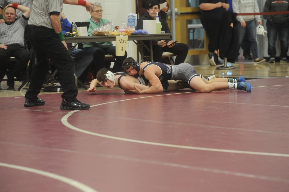 Philipsburg-Osceola’s Nate Fleck tallies a takedown of Bald Eagle Area’s Connor Maney in their 133-pound quarterfinals match of the District 6 Class 2A Championships on Friday, Feb. 17, 2023 in Altoona. Fleck beat Maney, 8-2.