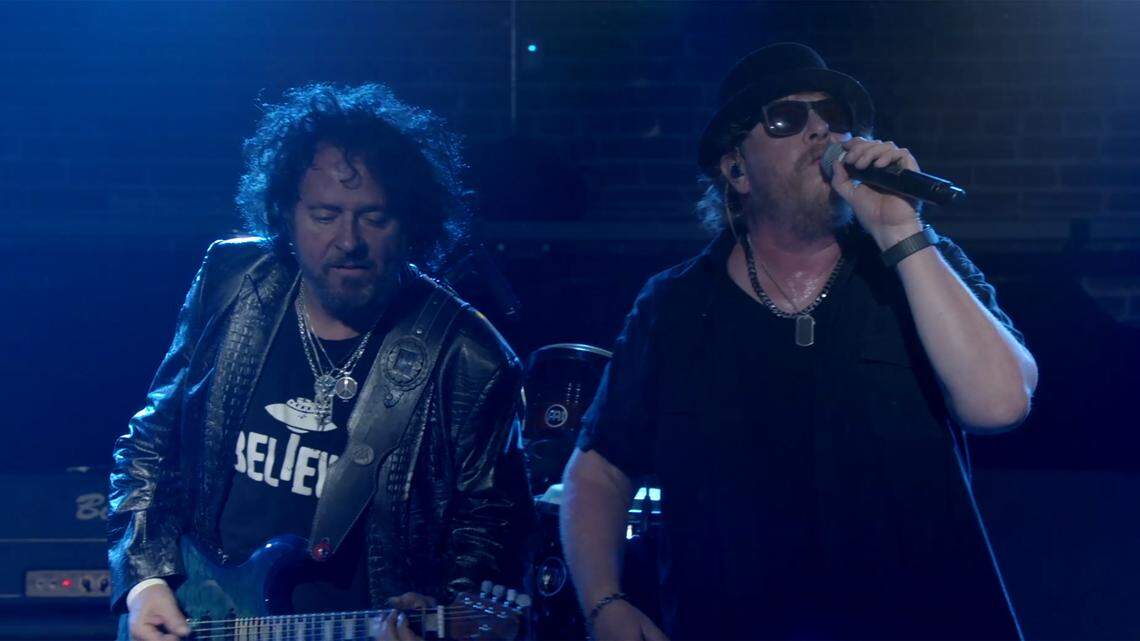 Steve Lukather, left, and Joseph Williams of Toto perform on stage. The band will open for Journey on Friday at the Bryce Jordan Center.