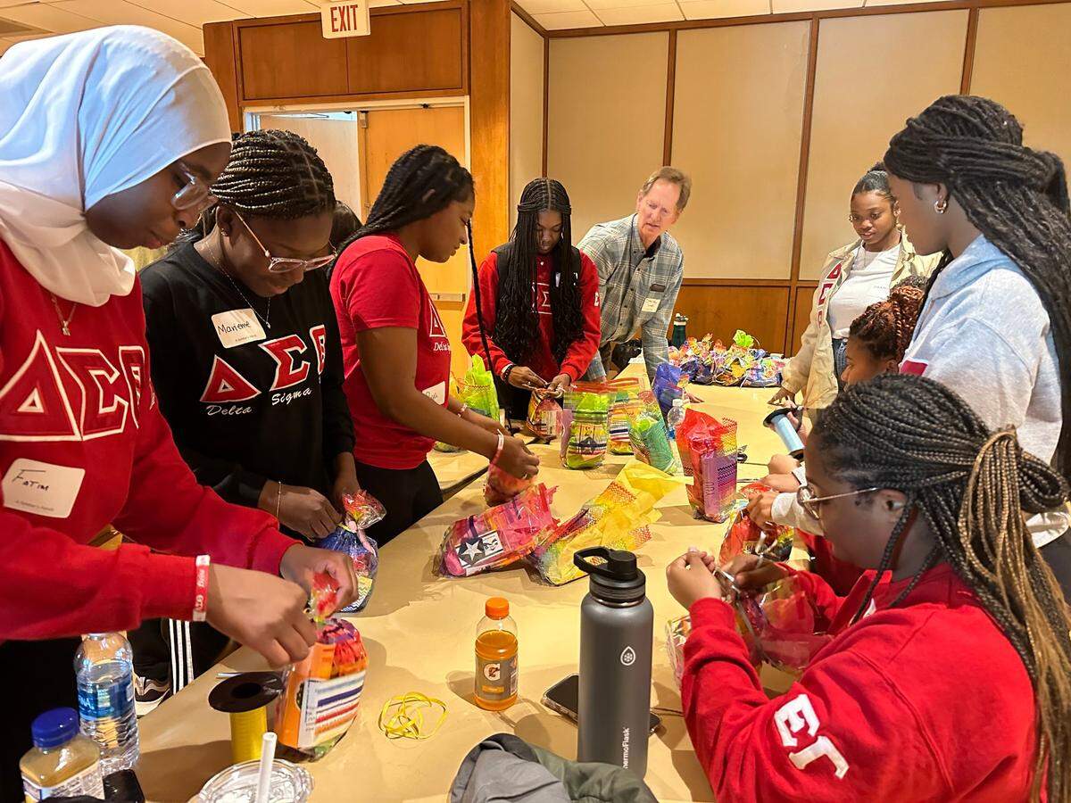 Penn State students Fatim Diaby, Marieme Dia, Adaora Nwachukwu Harris, Priya Cue, Leila Filien, Ava Starks, Mackenzie Jackson, Taylor Goodwin, De’jah Coates (left to right) prepare care packages for military service members with A Soldier’s Hands during the Martin Luther King Jr. Day of Service on Monday, Jan. 16, 2023, in the HUB-Robeson Center’s Alumni Hall.