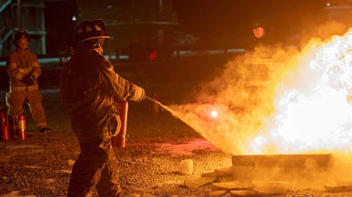 Carly Wojtaszek uses a fire extinguisher during a fire fighting training class at the Centre County Public Safety Training Center on Jan. 17, 2019.  