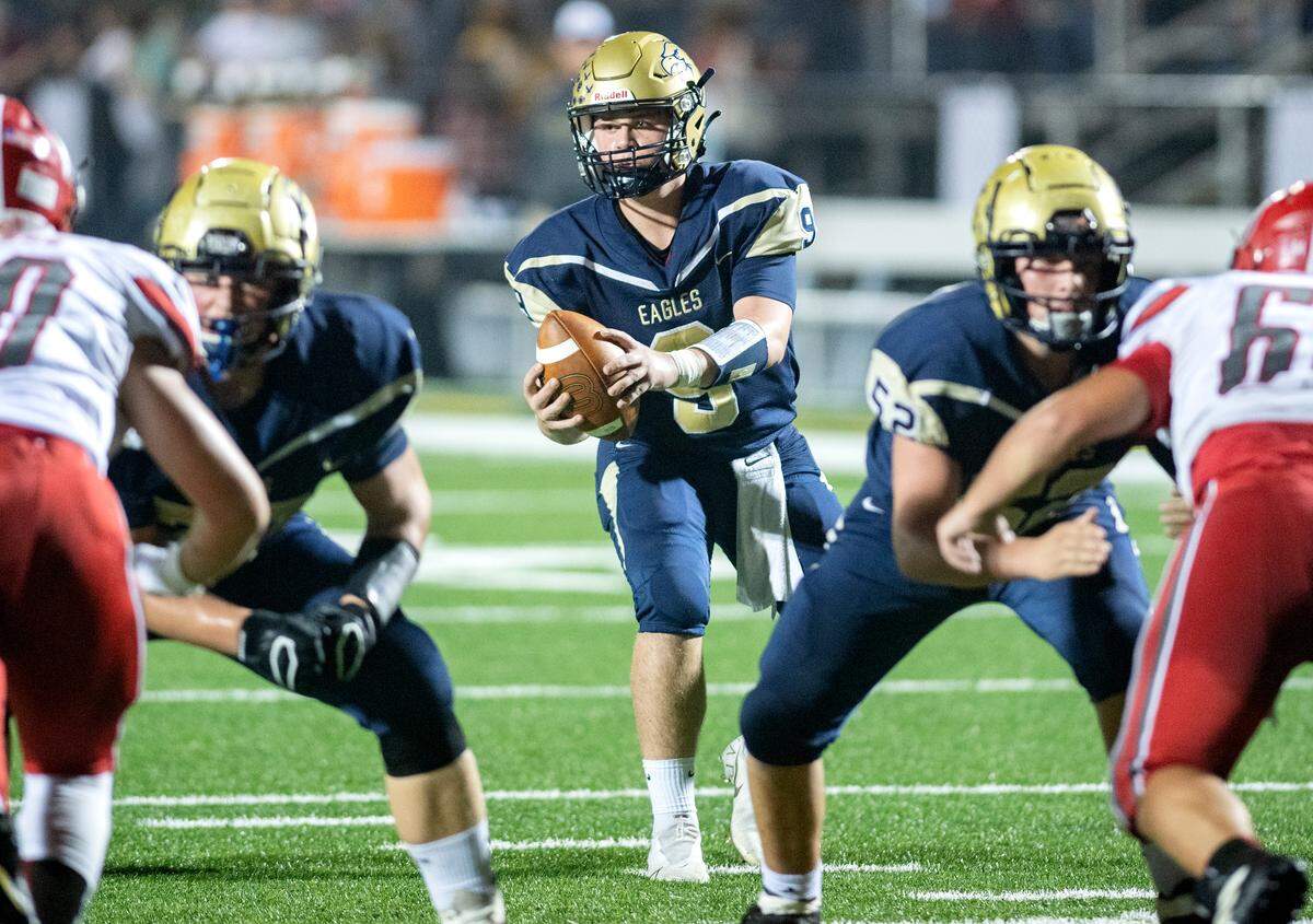 Bald Eagle Area quarterback Carson Nagle looks for an open teammate during the game against Bellefonte on Friday, Oct. 15, 2021.
