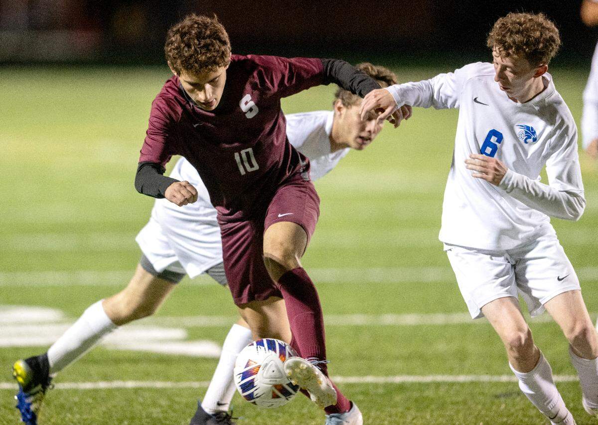 State College’s Matias Harte fights for the ball with a Central Mountain defender during the District 6 4A championship game on Monday Oct. 30, 2023.