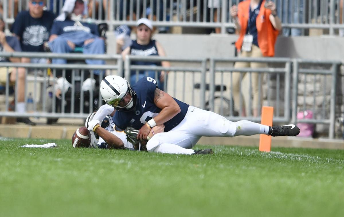 Penn State quarterback Trace McSorley tackles Kent State safety Elvis Hines during a game Saturday, Sept. 15, 2018 at Beaver Stadium.