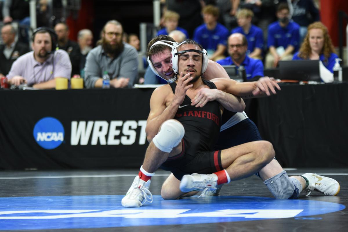 Penn State’s Nick Lee attempts to keep Stanford’s Real Woods from escaping in their 141-pound semifinals bout of the NCAA Championships on Friday, March 18, 2022 at Little Caesars Arena in Detroit. Lee hung on for a 3-2 win over Woods.