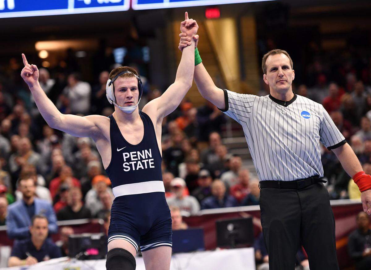 Penn State’s Jason Nolf is declared the winner over Ohio State’s Micah Jordan at 157 pounds during the fourth session of the NCAA Division I Wrestling Championships Friday, March, 16, 2018 at the Quicken Loans Arena in Cleveland, Ohio.