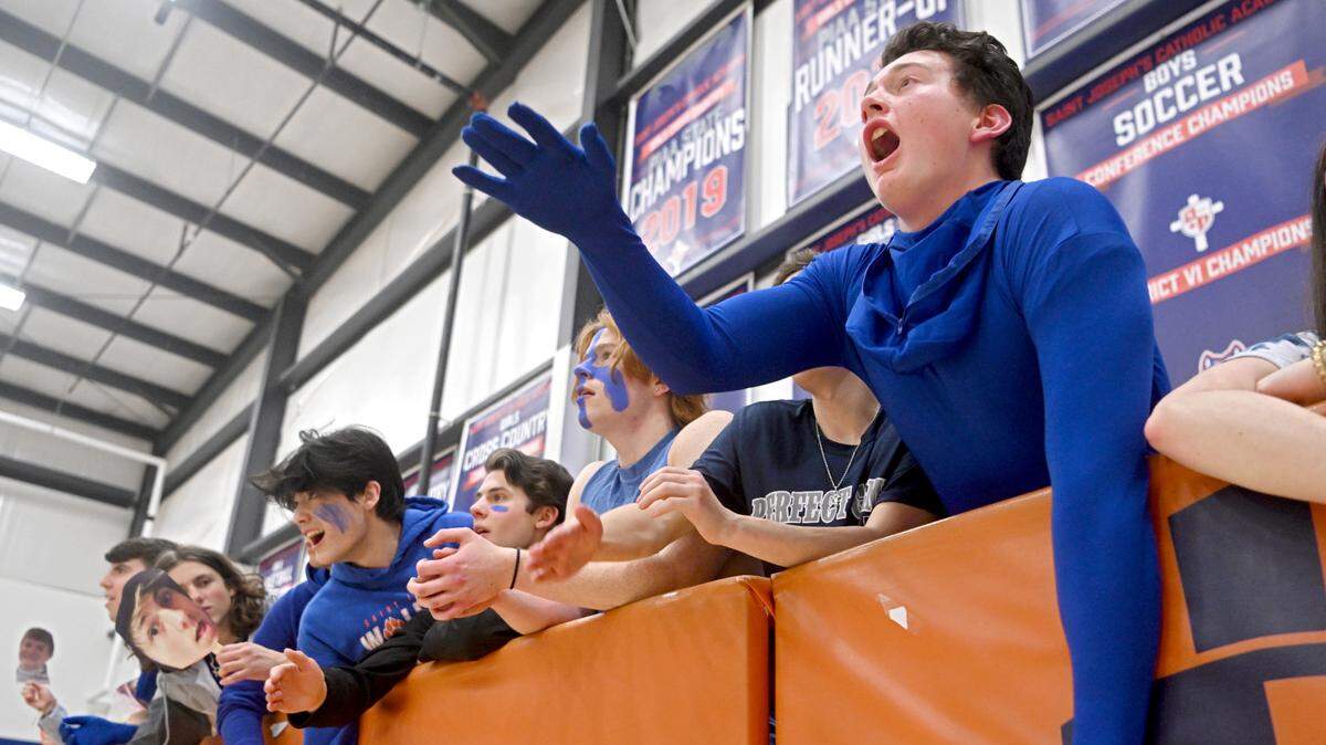 The Saint Joseph’s student section cheers on the boys basketball team during the game against Juniata Valley on Wednesday, Feb. 1, 2023.