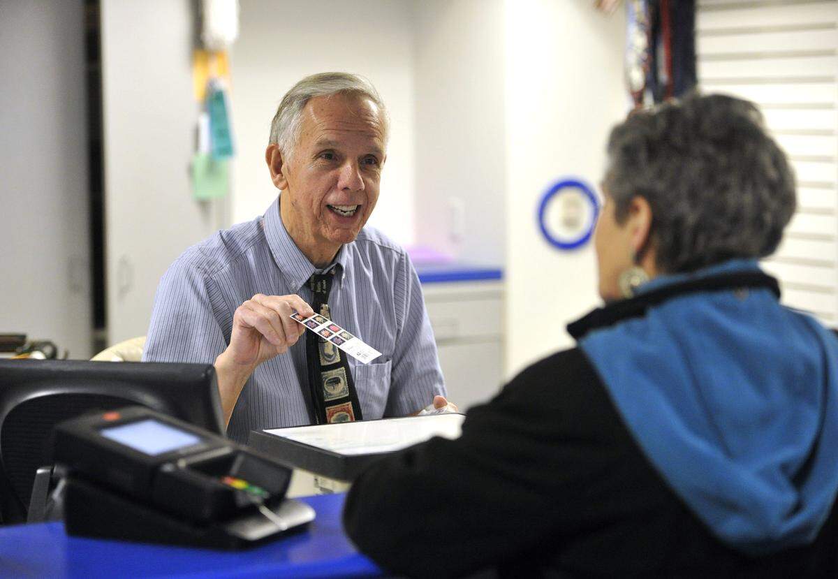 Mike Herr, otherwise known as "Mike the Mailman," serves customers in the post office located on the Penn State University campus February 4, 2016. 