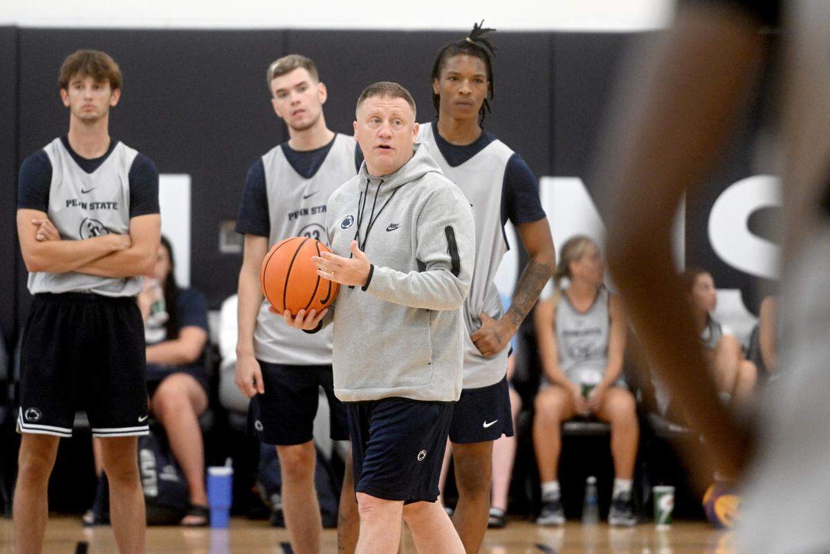 Penn State men’s basketball coach Mike Rhoades instructs his players during a summer workout on Tuesday, July 11, 2023.