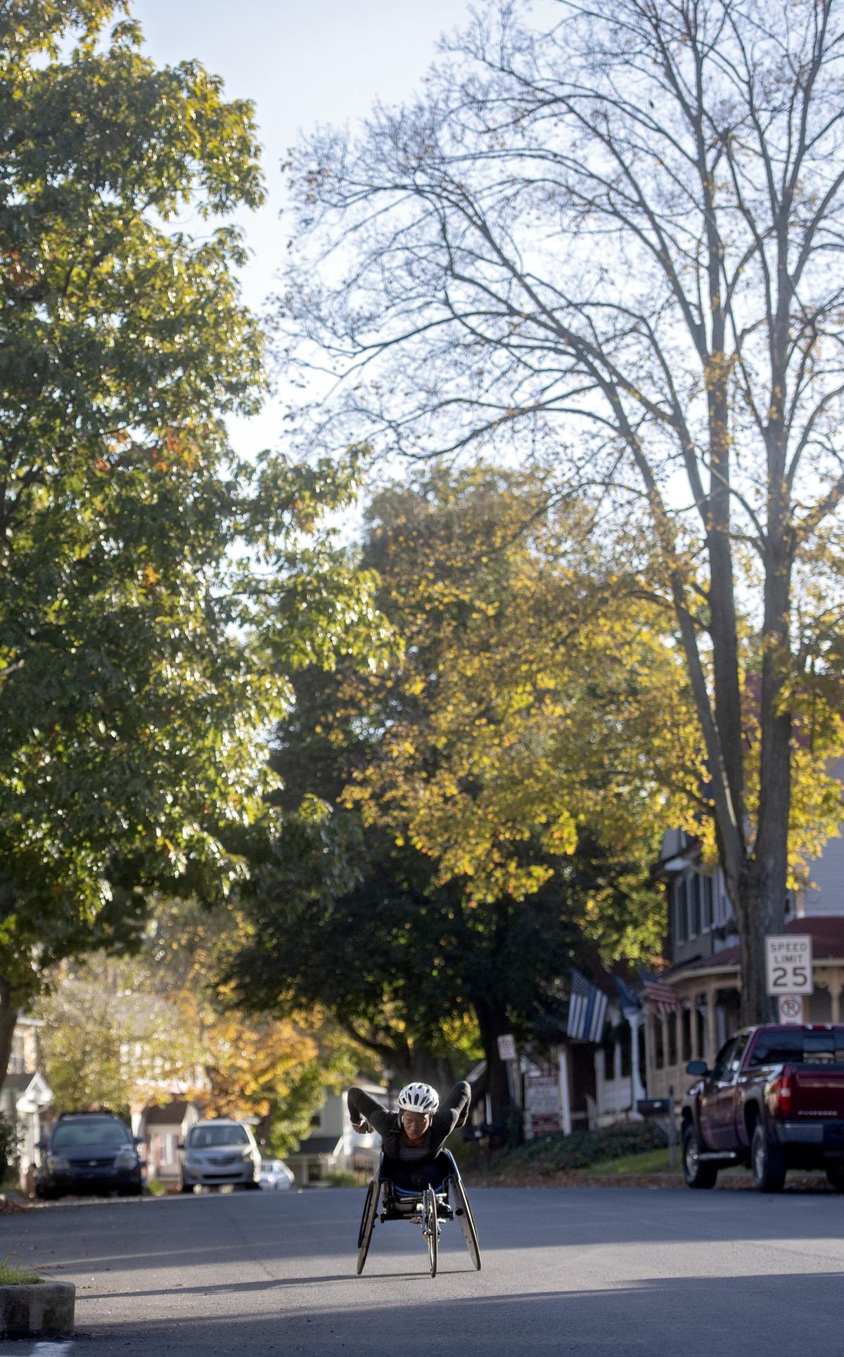 Michelle Wheeler glides down Main Street in Boalsburg during her training session on Tuesday, Oct. 23, 2018.
