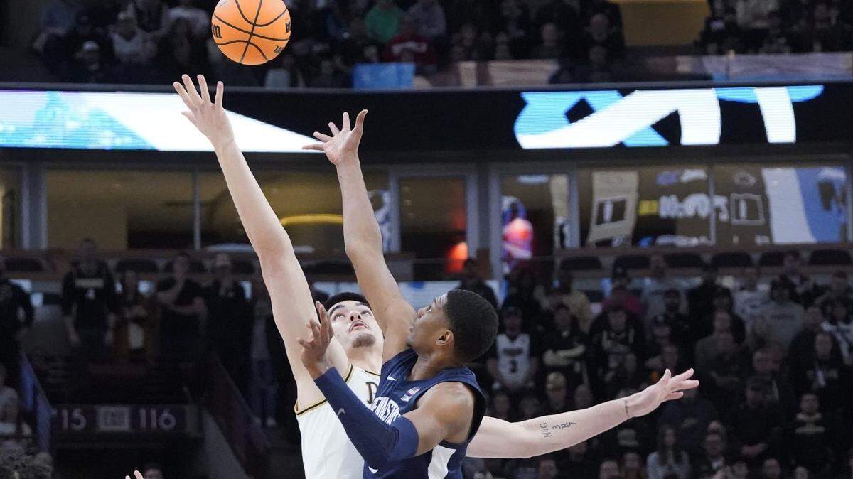Purdue center Zach Edey and Penn State forward Kebba Njie go for the ball during the first half Sunday at United Center.