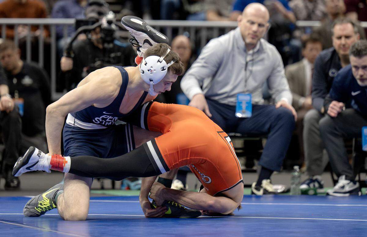Penn State's Luke Lilledahl controls Oklahoma State’s Troy Spratley in a 125-pound semifinal bout of the NCAA wrestling championships on Friday, March 20, 2026.  